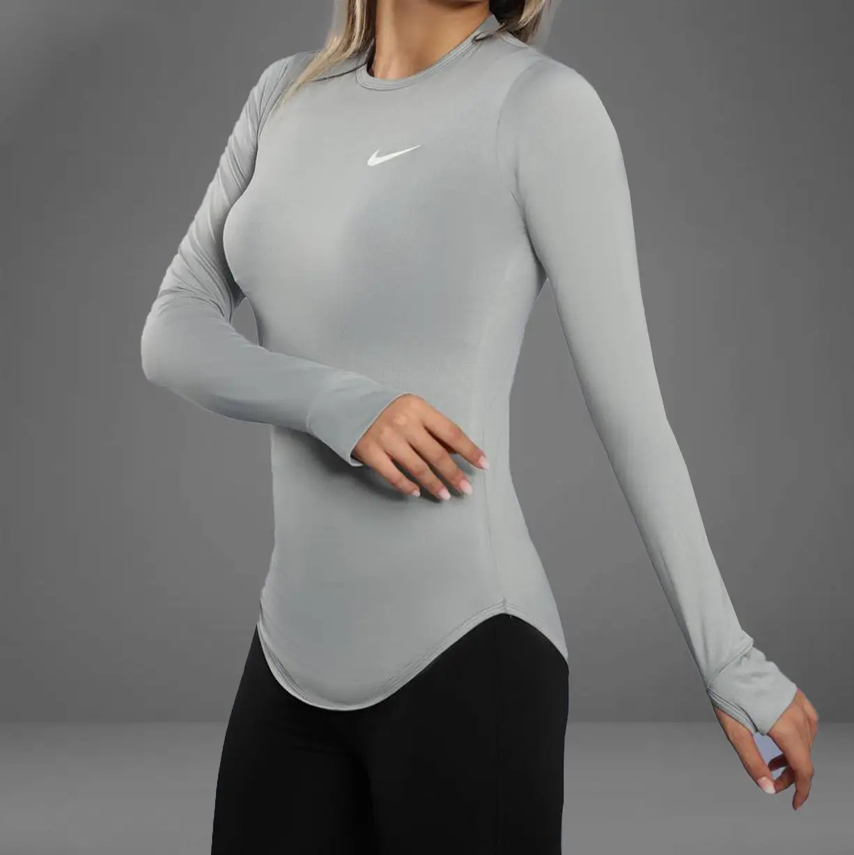 تصویر تیشرت ورزشی آستین بلند انگشتی زنانه هلالی نایک 